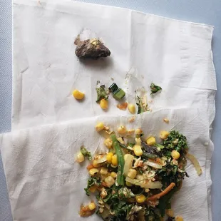 a plate of food on a napkin