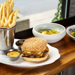 a burger and french fries on a table