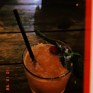 a drink in a glass on a table