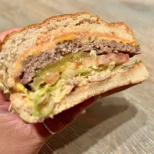 Cheeseburger. The grilled beef patty is slightly charred on the outside while remaining juicy inside. I'm a fan and highly recommend.