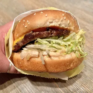 Cheeseburger. The grilled beef patty is slightly charred on the outside while remaining juicy inside. I'm a fan and highly recommend.