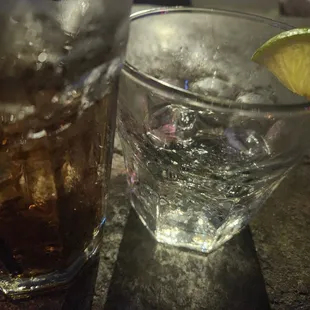 two glasses of soda and a lime wedge
