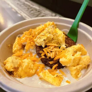 a bowl of scrambled eggs and cheese