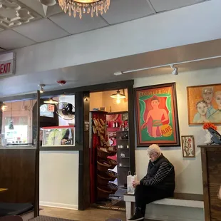 a man sitting on a bench in a restaurant