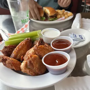 My sons burger, naked wings-sauce on side (my choice)