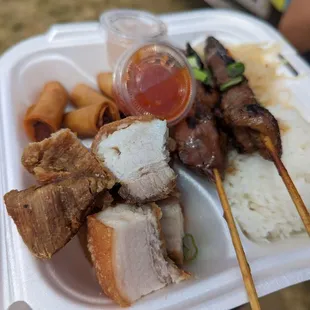 Fiesta combo - rice, pancit, lechon, pork skewers, lumpia