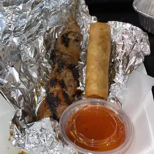 That's a chicken on a stick n a pork lumpia, absolutely delish!!