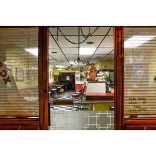 a view of a restaurant through the window