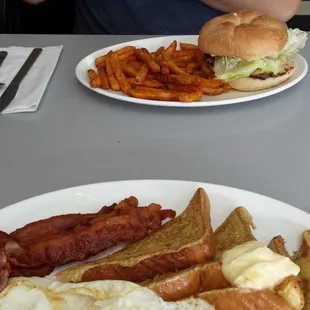 Cheeseburger with fries and french toast with 2 eggs and bacon. The fries taste just like fries from Popeyes!