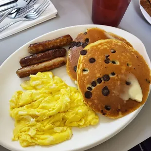 Chocolate chip hot cakes with scrambled eggs and sausage ($7.65)