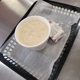 a bowl of soup on a tray