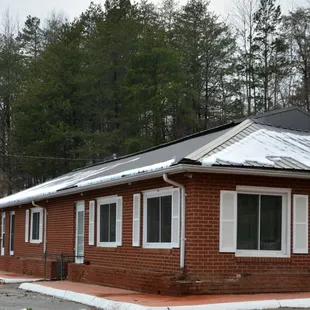 a red brick building with white trim
