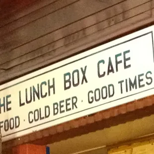 A sign over the bar. Good food, cold beer, good times!