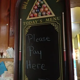 A cool pay here sign. And yes, they do have a pool table in the back!
