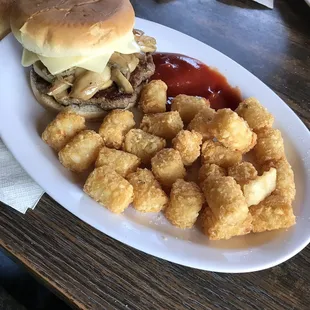 Mushroom Swiss burger and tots. Delicious!