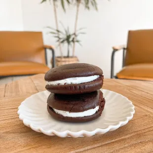 three chocolate sandwich sandwiches on a plate