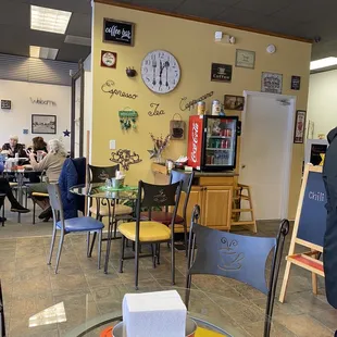 people sitting at tables and eating