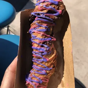 a donut with purple icing