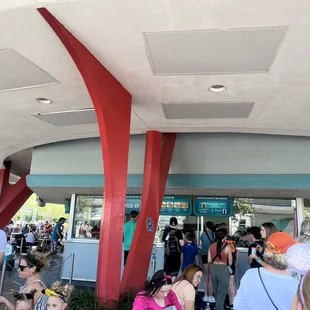 a crowd of people waiting in line