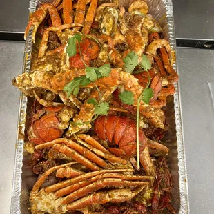 a tray of cooked crabs