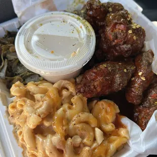 Macaroni and cheese, greens, spicy lemon pepper wings
