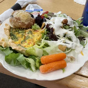 Quiche with salad and muffin.