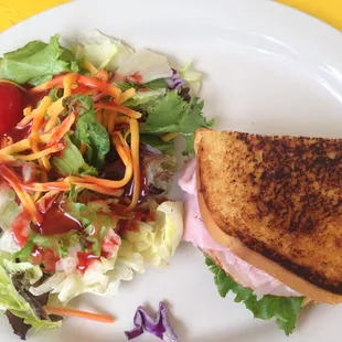 Club Sandwich (half) and side salad.