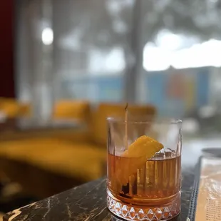 a drink in a glass on a table