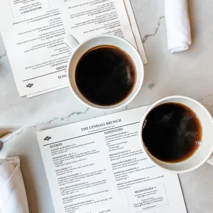 two cups of coffee on a table