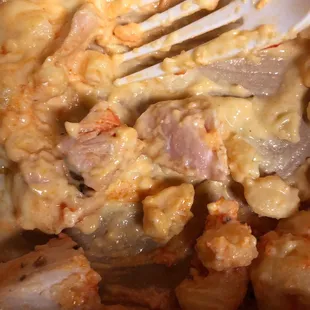 Undercooked chicken- actual photo of pink pieces that were chewy.