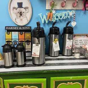 a variety of coffees and teapots