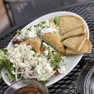 a plate of salad and bread