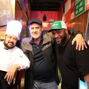 three men posing for a picture
