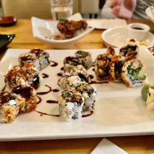 a plate of sushi rolls