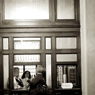 a woman standing in front of a window