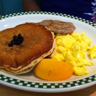 Eggs, sausage, and blueberry pancakes.