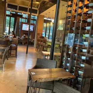 a dining area with tables and chairs