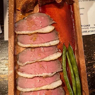 Smoked duck - thin sliced coffee cured duck with sweet potato crisps, pickled long beans, and a sour cherry sauce