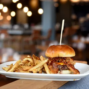 a burger and fries on a plate