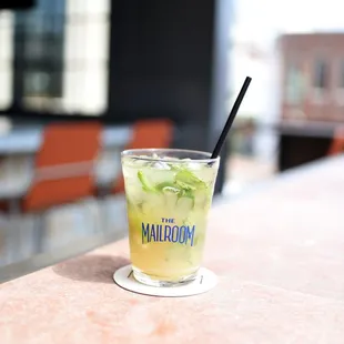 a glass of lemonade on a table