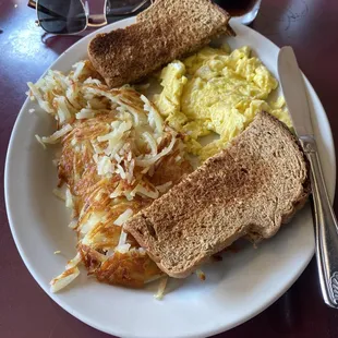 Two eggs, potato's and toast