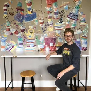 Wylie Caudill, an amazing local artist, with his beautiful mural for the shop!