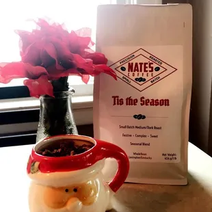 a bag of mate's tea and a santa mug