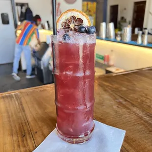 a tall glass of fruity drink