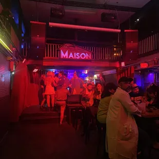 a group of people sitting at a bar