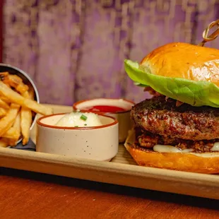 a burger and french fries on a tray
