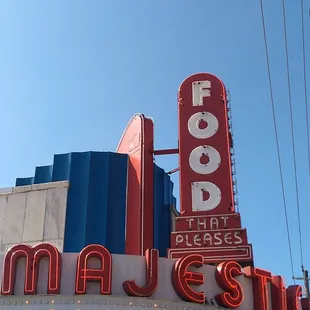 Check out the art deco vibe like that of a movie theater.  &quot;Food that pleases&quot; is a very funny slogan, as is, &quot;If it pleases you.&quot;