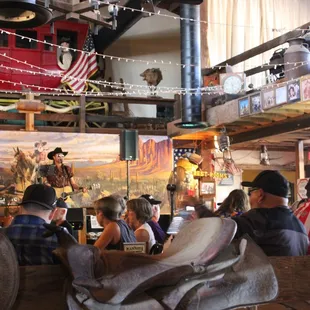 a crowd of people sitting at a bar
