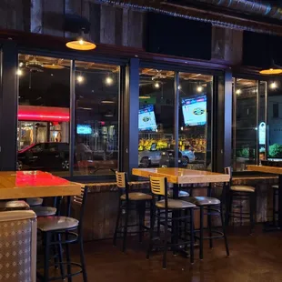 Bar tables by windows, slide open