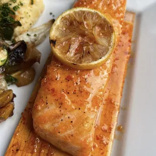 a plate of salmon and vegetables